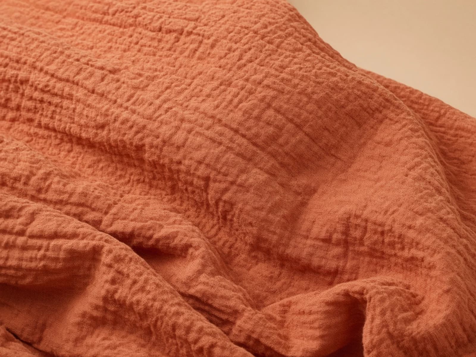 Dusty rose crinkle cotton with an irregular puckered surface