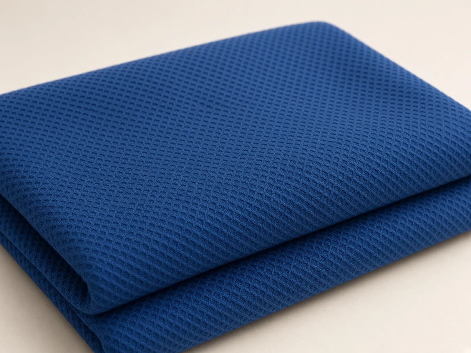 Cobalt mercerized cotton piqué with raised geometric texture