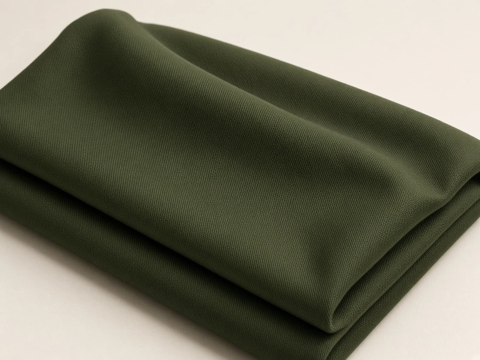 Olive mercerized cotton twill with a refined diagonal grain