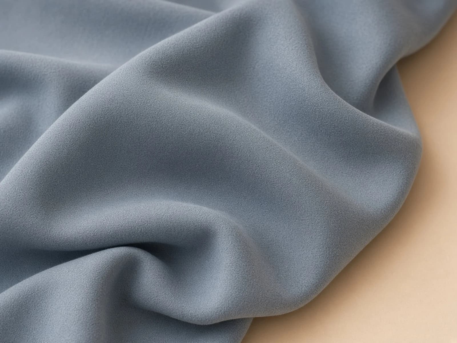 Peach-skin woven fabric with a fine short sueded nap