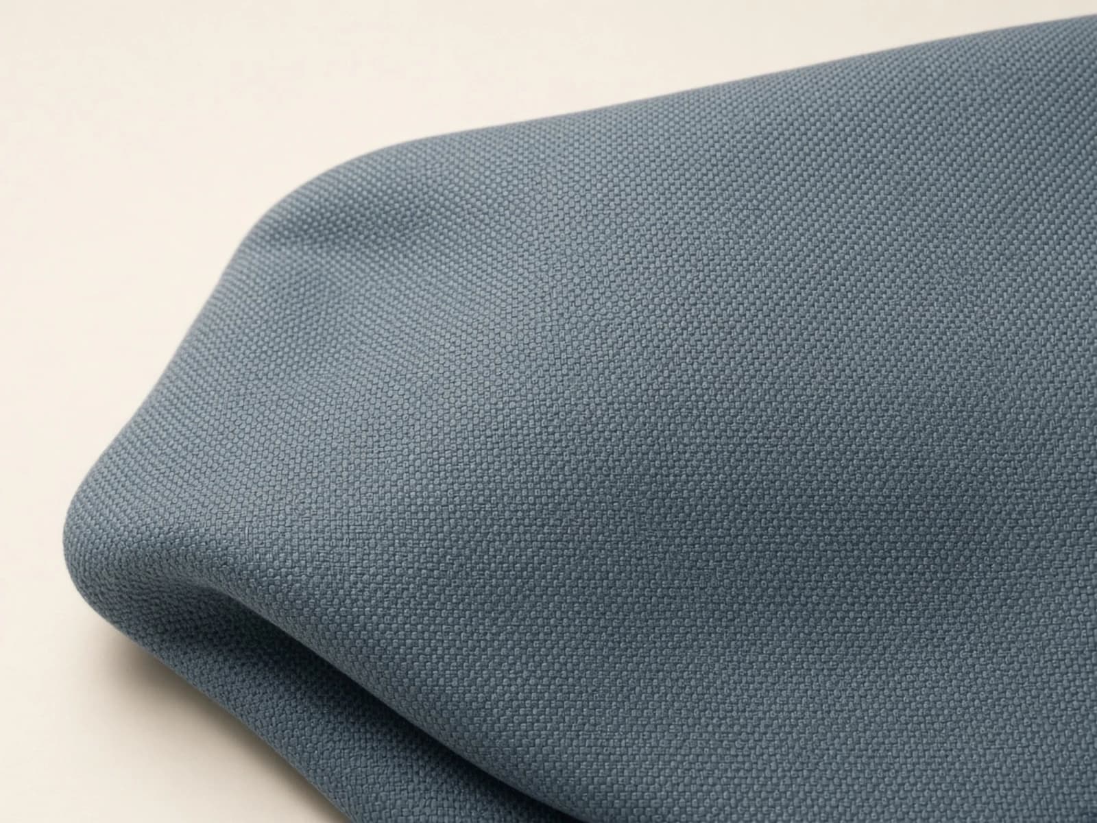 Slate performance upholstery with a compact basketweave grid