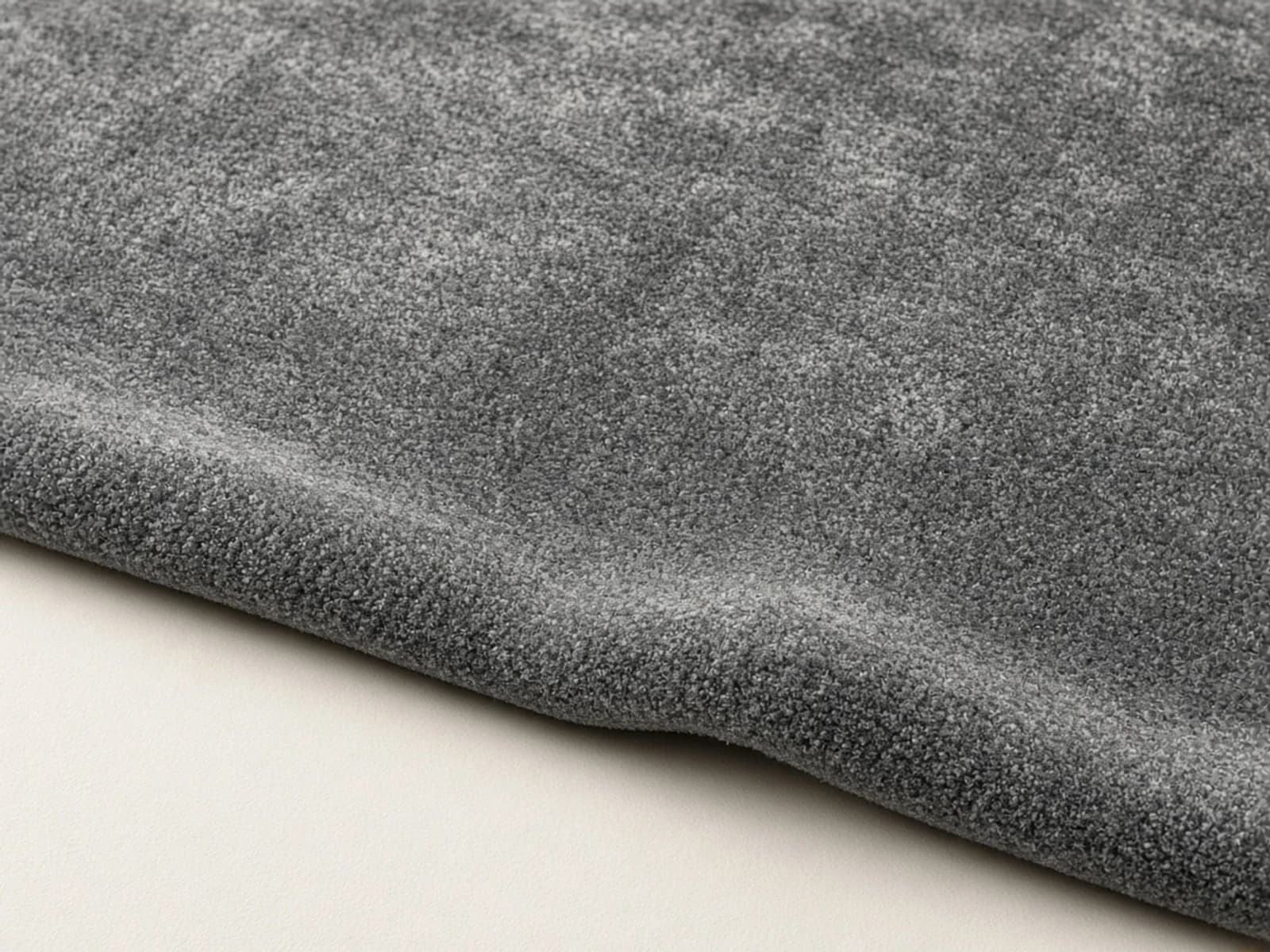 Grey recycled PET rug with a dense synthetic cut pile