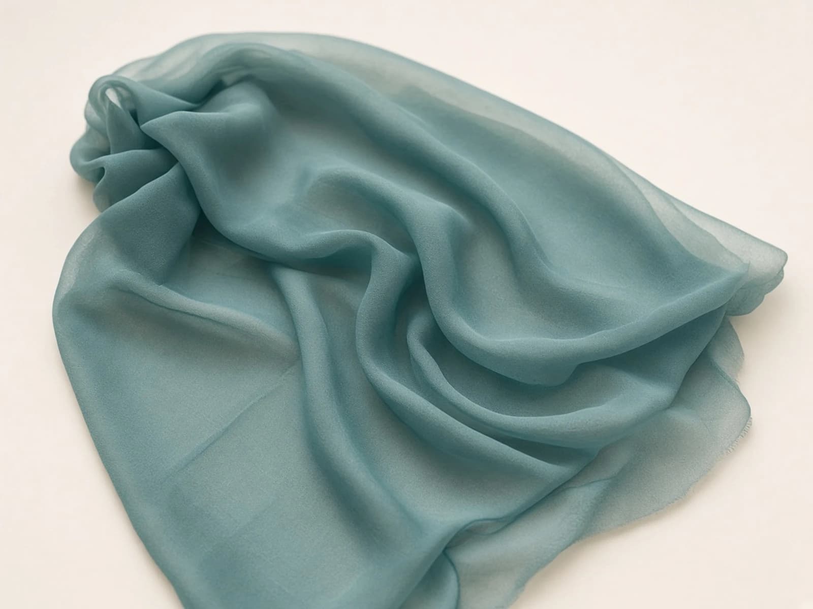 Muted teal stretch chiffon with lightweight semi-sheer folds