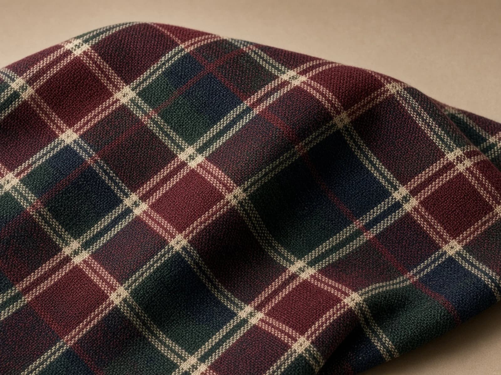 Woven wool tartan with burgundy, green, navy and cream bands