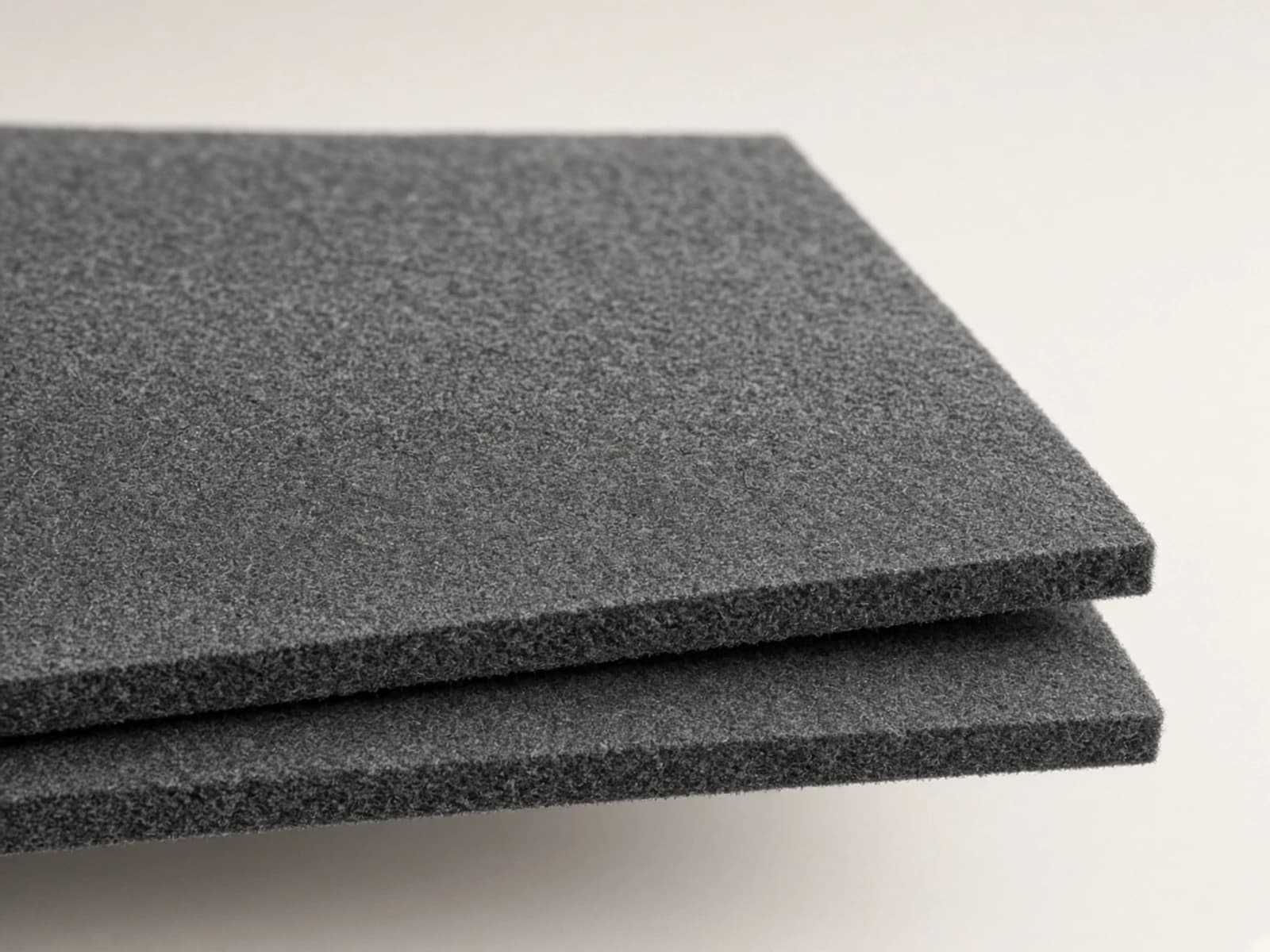 Charcoal wool felt upholstery with a dense compact fiber surface