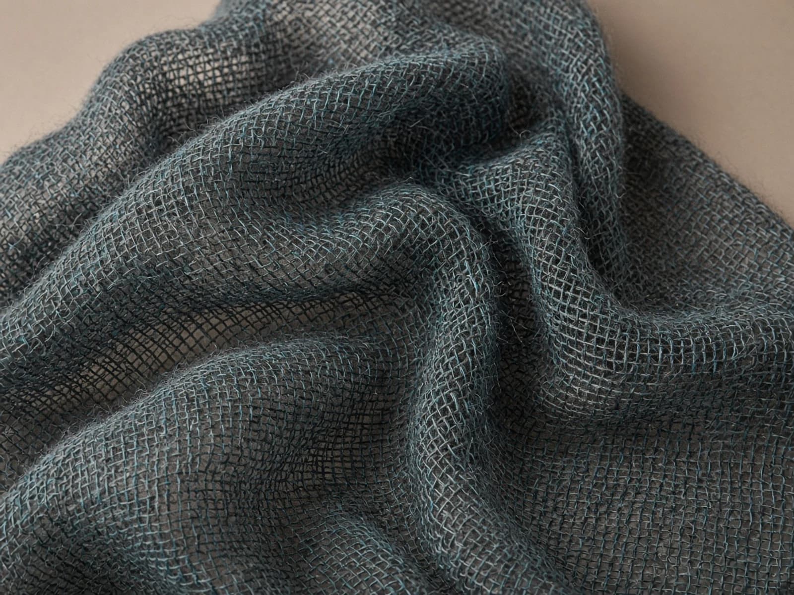 Wool-mohair open weave with airy gaps and a fine fiber halo
